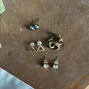 Assorted earrings and charm